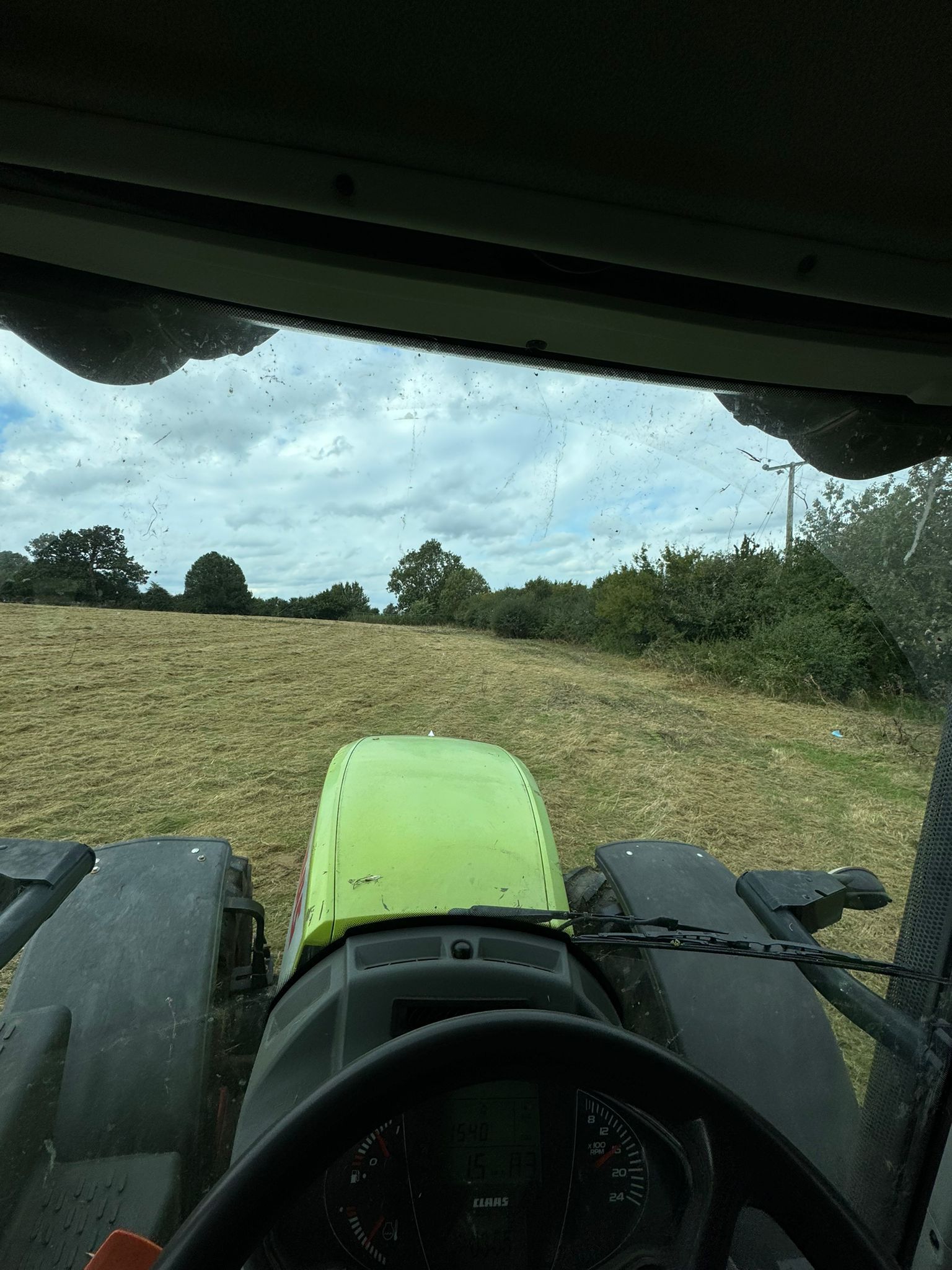 Professional tractor work operation showing grounds maintenance equipment in action